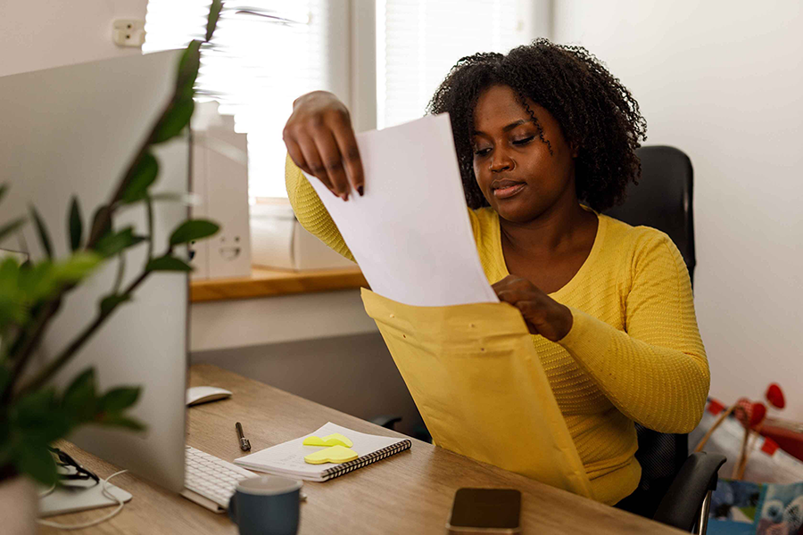 Woman holding an envelope